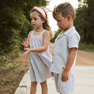 light blue checker set includes short sleeves top with buttons on the front and a short 