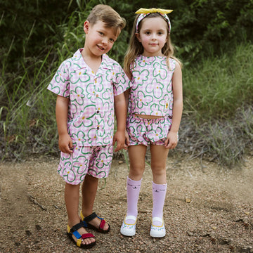 pink checker with green flowers set includes short sleeves top with buttons on the front and a short 